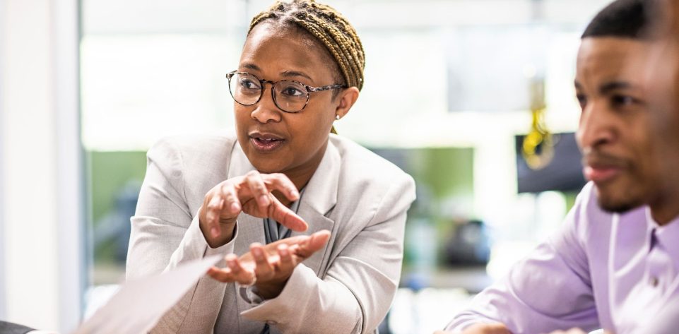 Businesswoman leading office discussion